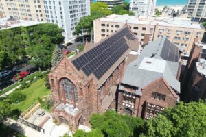 Rooftop solar array on the steep roof of the historic Church of the Atonement in Chicago's Edgewater neighborhood, installed by Windfree Solar